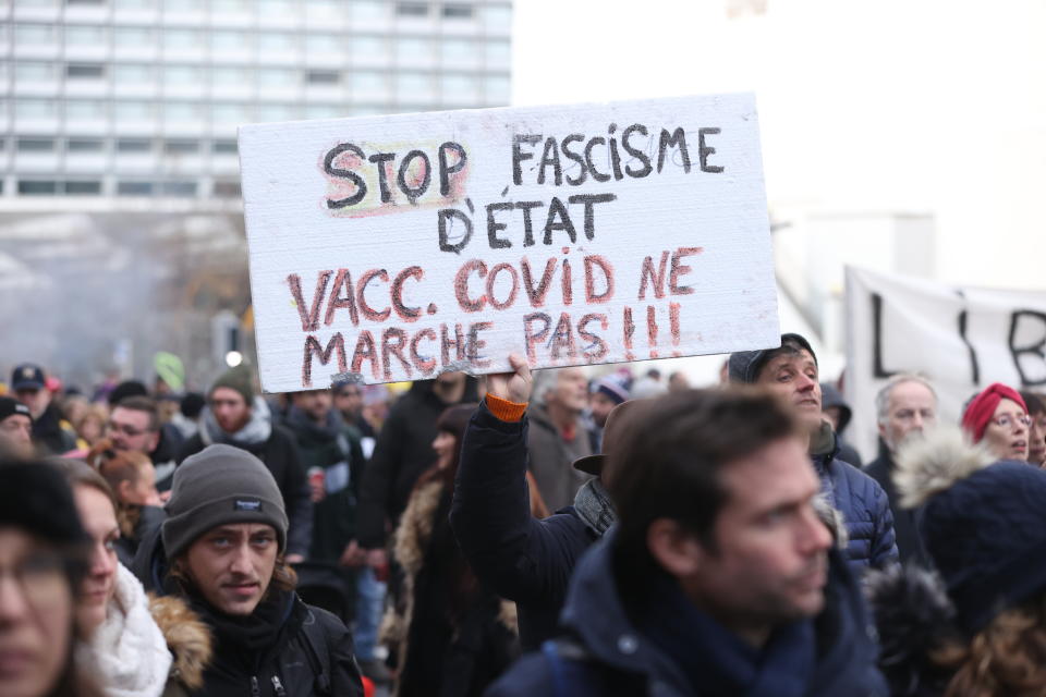 People march in Brussels against a compulsory vaccination campaign.