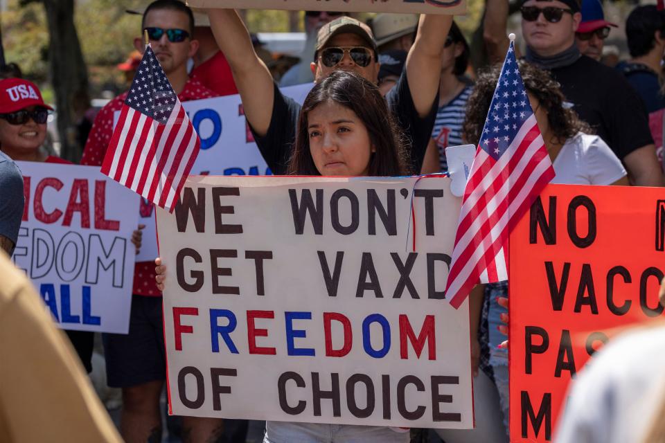 Anti-vaccination protesters rally in Los Angeles near City Hall in August in opposition to the City Council vote to introduce an ordinance to require proof of vaccination to enter many public indoor spaces.