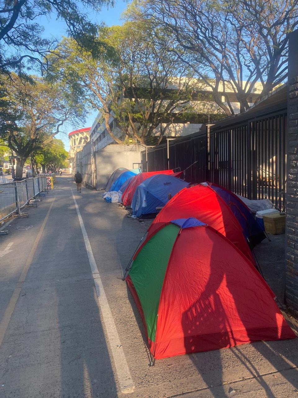 Fans with floor seating for Taylor Swift's Eras Tour concert in Buenos Aires camp out in tents to be first in line to get into the stadium.