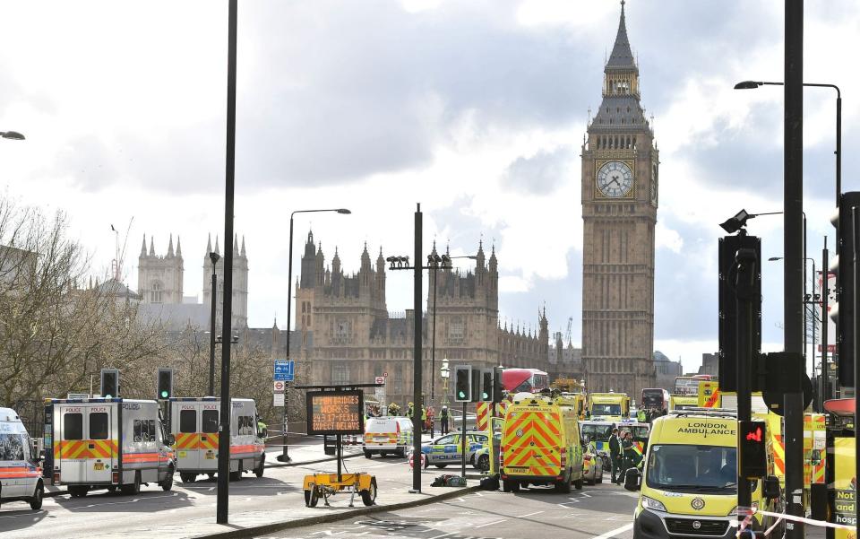 Emergency services on Westminster Bridge, close to the Palace of Westminster - Credit: PA