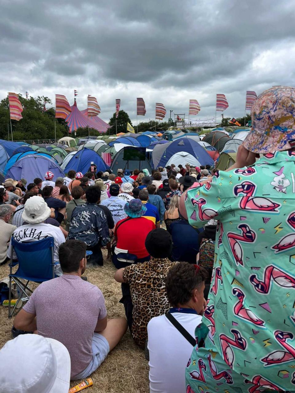 Glastonbury festival-goers tune into the England v Slovakia game (The Indepenent)