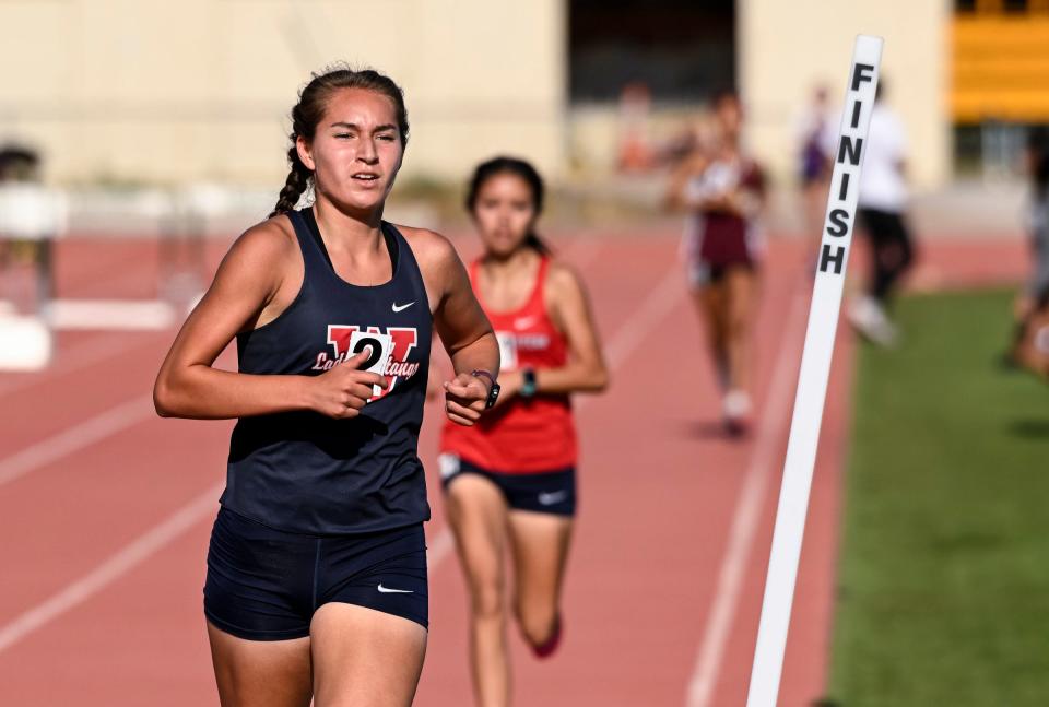 Tulare Western's Carly Carrera leads the girls 1600 meter during the 2023 West Yosemite League high school track and field championships on Thursday, May 4, 2023.