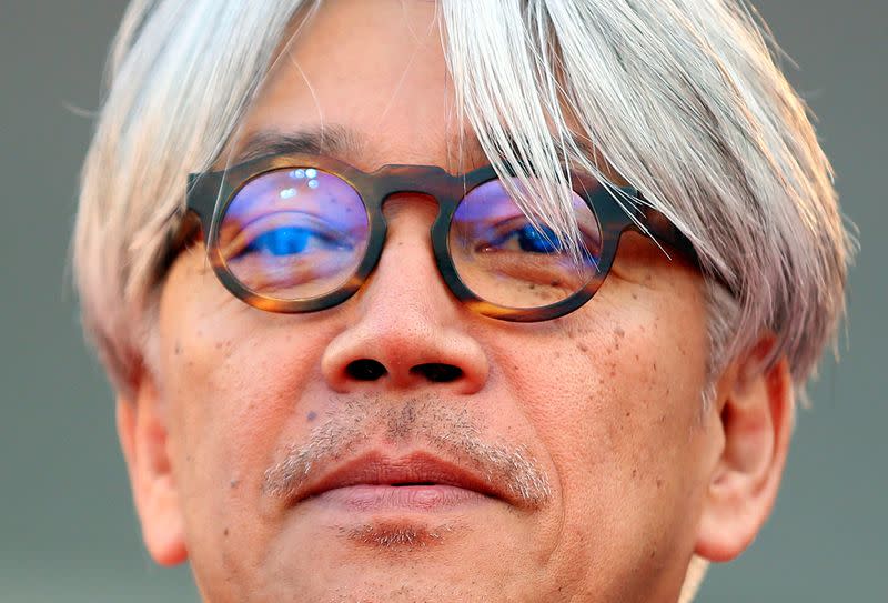 FILE PHOTO: Sakamoto, jury member and Japanese musician, looks on as he arrives on the red carpet for the premiere of "Gravity" by director Alfonso Cuaron at the 70th Venice Film Festival