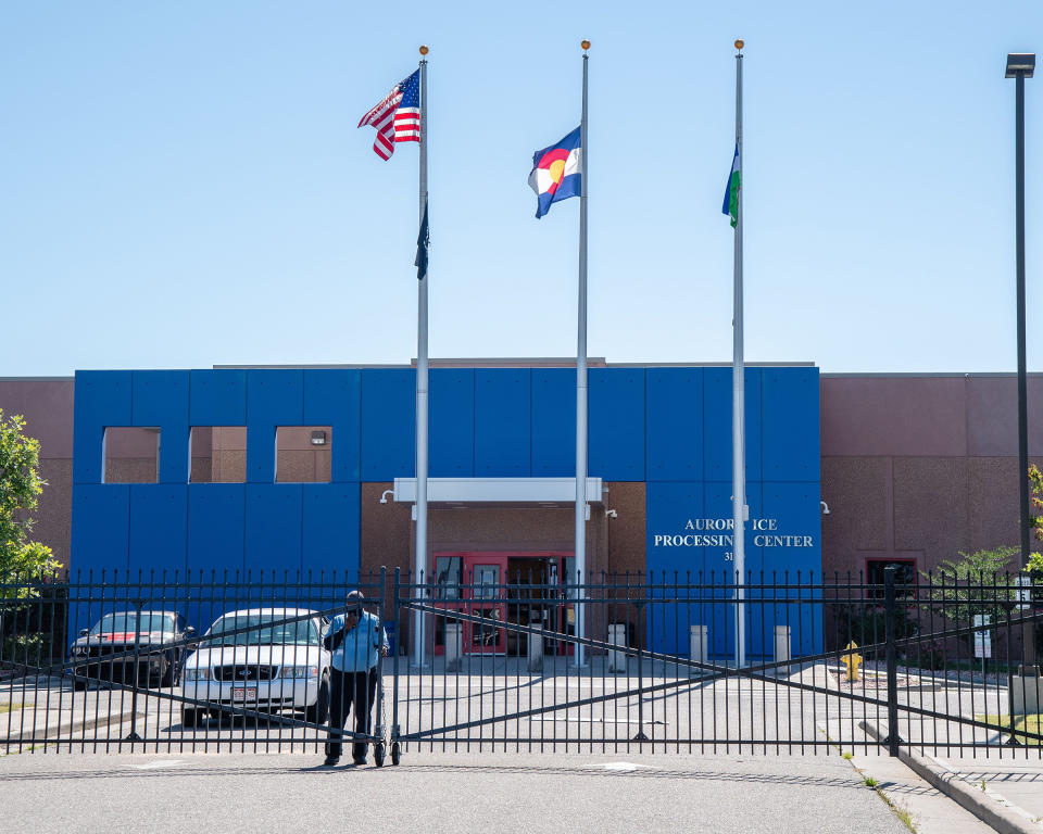 A security guard stands outside of the Aurora ICE Processing Center in Aurora, Colorado on July 5, 2020. | Amy Harris—Shutterstock