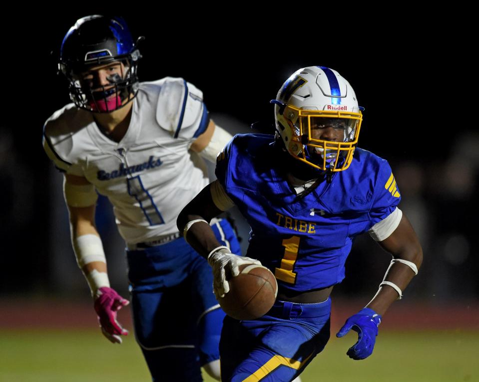 Wi-Hi's Malique Leatherbury (1) scores a touchdown against Decatur Friday, Nov. 12, 2021, in an 2A Region second round playoff at Wicomico County Stadium in Salisbury, Maryland. The Seahawks defeated the Tribe 30-27.