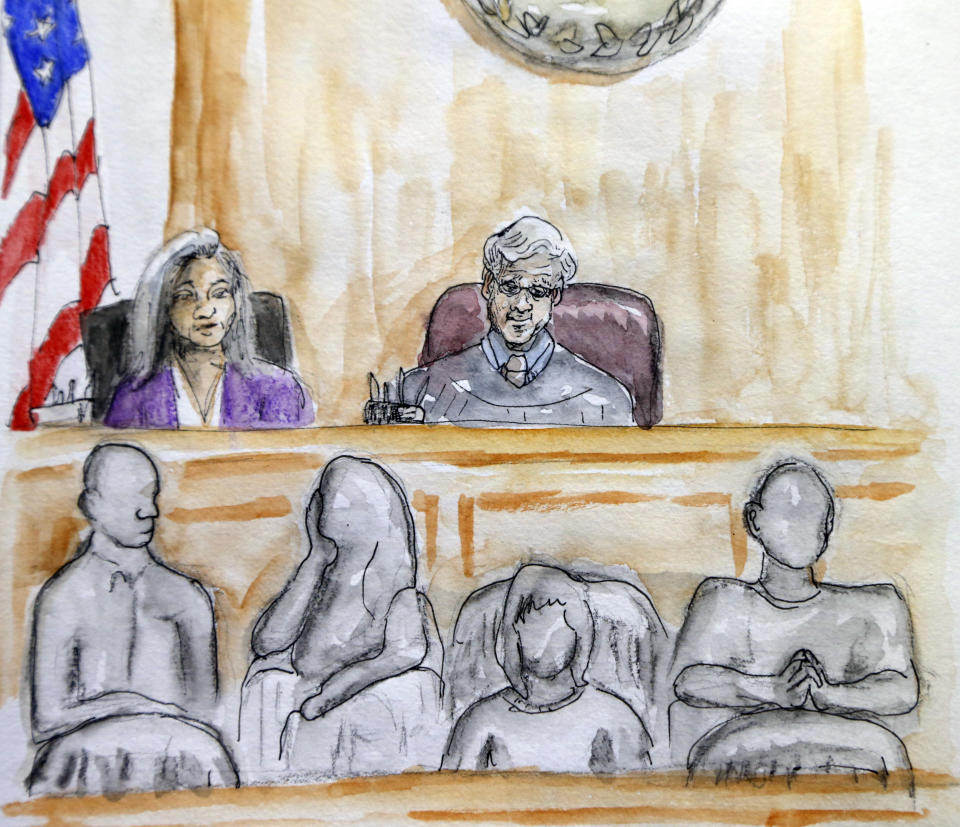 In this courtroom sketch Judge Richard Moore, top right, presides over the trial of James Alex Fields Jr. during the second day of jury selection in Charlottesville General District Court in Charlottesville, Va., Tuesday, Nov. 27, 2018. Fields is accused of killing a woman during a white nationalist rally in Virginia last year. (Izabel Zermani via AP)