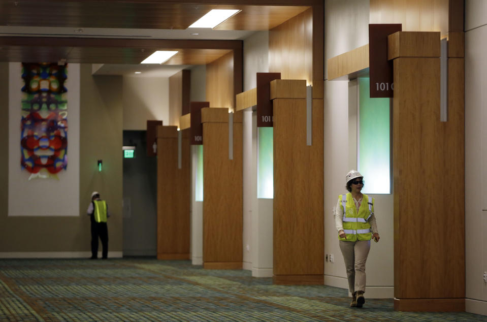 This April 12, 2013, photo shows a hallway with meeting rooms at the Music City Center in Nashville, Tenn. Nashville's new convention center is transforming the look of downtown with its wavy roof dominating six city blocks, but tourism officials hope the eye-catching facility will also show business travelers a revitalized Music City. (A P Photo/Mark Humphrey)