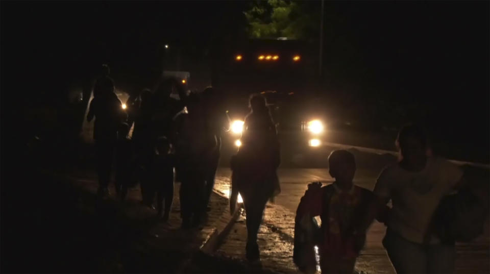 In this image from a video, a migrants caravan leave San Pedro Sula, Honduras early Saturday, Jan. 20, 2024. A caravan of some 500 migrants that departed northern Honduras in hopes of reaching the United States dissolved Sunday after crossing the border into Guatemala, the Guatemalan Migration Institute reported. (AP Photo)