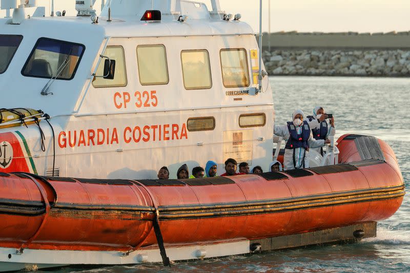 Migrants disembark in Sicily after surviving a deadly shipwreck
