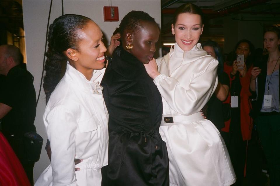 Aighewi is photographed with fellow models Shanelle Nyasiase (middle) and Bella Hadid (right) after Brandon Maxwell's show.