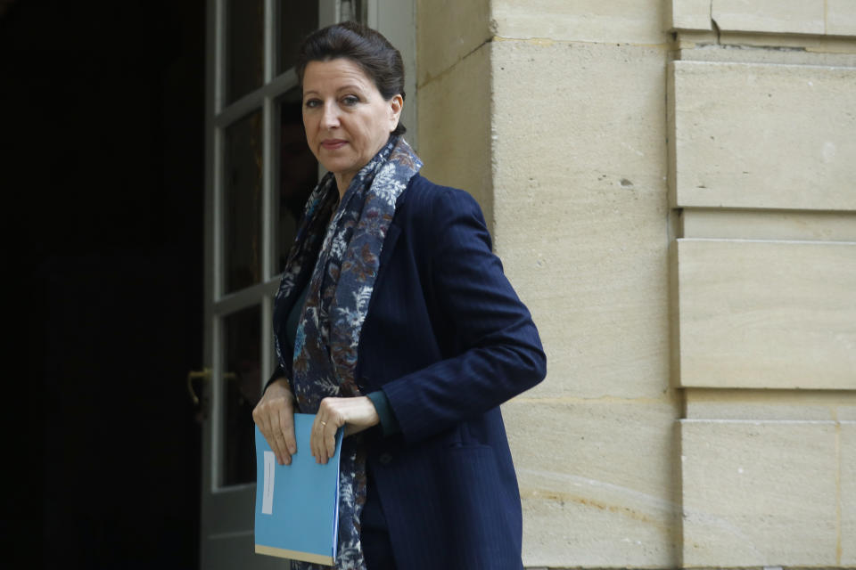 France's Health Minister Agnes Buzyn arrives to a meeting, at the hôtel Matignon, Paris, Saturday, Feb. 8, 2020. The announcement Saturday Agnes Buzyn brings the total number of people with the virus in France to 11. Buzyn said they appear linked to a British person who stayed there in late January, and was later to confirmed to have the virus after returning to Britain. (AP Photo/Thibault Camus)