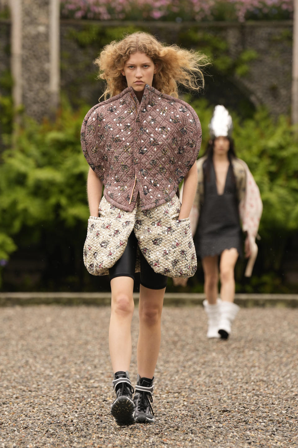 A model wears a creation as part of the women's Louis Vuitton Cruise 2024 collection, unveiled on Isola Bella (Bella Island) on Lake Maggiore in Stresa, northern Italy, Wednesday, May 24, 2023. (AP Photo/Antonio Calanni)