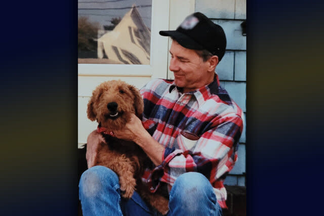 A photo of Sgt. Robert Zink playing with a dog, featured in New York Homicide 203