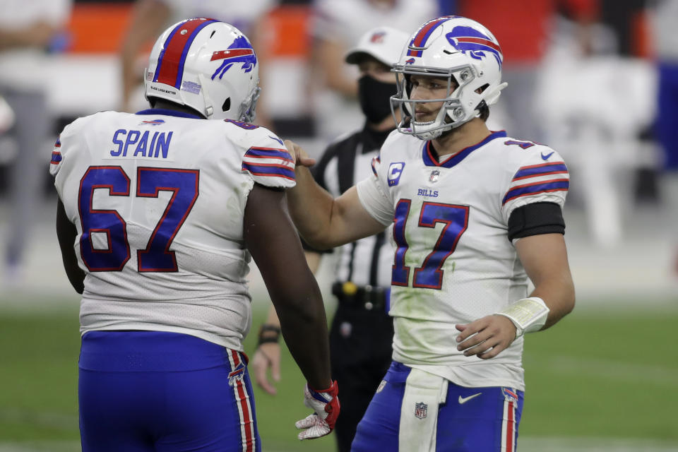 Buffalo Bills quarterback Josh Allen (17) celebrates with offensive guard Quinton Spain after defeating the Las Vegas Raiders in an NFL football game, Sunday, Oct. 4, 2020, in Las Vegas. The Bills won 30-23. (AP Photo/Isaac Brekken)