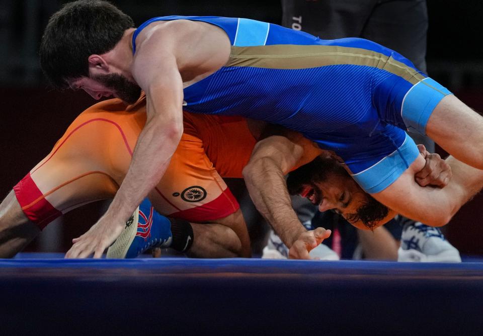 <div class="paragraphs"><p>India's Ravi Dahiya against Zavur Uguev of Russian Olympic Committee during the Tokyo Olympics gold medal match.</p></div>