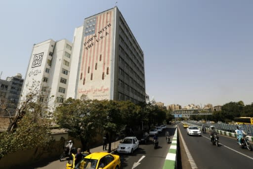 A mural in Tehran shows a US flag with skulls instead of stars