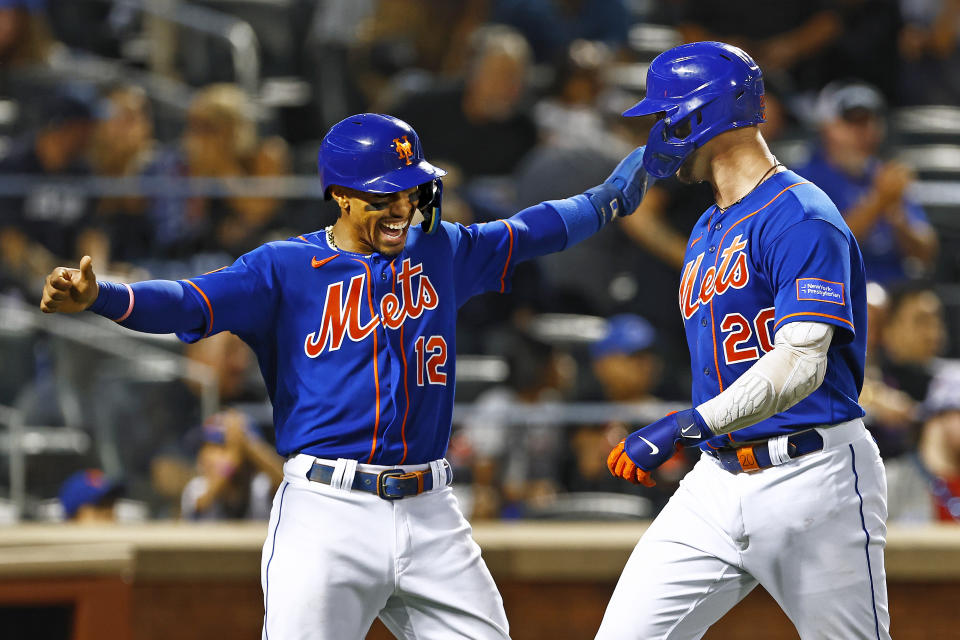 New York Mets' Francisco Lindor (12) celebrates after Pete Alonso's (20) two-run home run against the Chicago Cubs during the third inning of a baseball game, Monday, Aug. 7, 2023, in New York. (AP Photo/Rich Schultz)