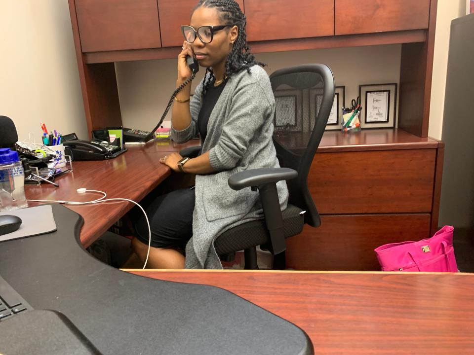 Shatoyia Moss takes a call at Bloomington City Hall on Aug. 4, 2023.