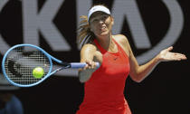 FILE - In this Jan. 21, 2020, file photo, Maria Sharapova makes a forehand return to Donna Vekic during their first round singles match at the Australian Open tennis championship in Melbourne, Australia. Sharapova is retiring from professional tennis at the age of 32 after five Grand Slam titles and time ranked No. 1. She has been dealing with shoulder problems for years. In an essay written for Vanity Fair and Vogue about her decision to walk away from the sport, posted online Wednesday, Feb. 26, 2020, Sharapova asks: “How do you leave behind the only life you’ve ever known?”(AP Photo/Lee Jin-man, File)