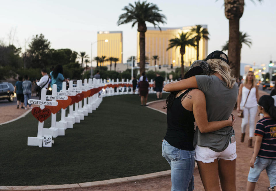 FILE - In this Oct. 5, 2017, file photo, a memorial displaying 58 crosses by Greg Zanis stands at the Welcome To Las Vegas Sign in Las Vegas. Each cross has the name of a victim killed during the mass shooting at the Route 91 Harvest country music festival. Two prominent gun safety organizations say they'll host a forum for Democratic presidential candidates in Las Vegas on Oct. 2, 2019, the day after the second anniversary of the deadliest mass shooting in modern U.S. history. March For Our Lives and the Giffords group told The Associated Press that the forum is the first of its kind for presidential hopefuls. (Mikayla Whitmore/Las Vegas Sun via AP, File)