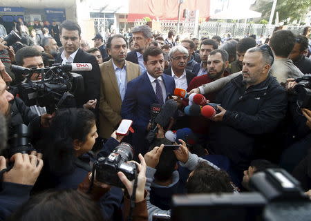 Selahattin Demirtas (C), co-chairman of the pro-Kurdish Peoples' Democratic Party (HDP), talks to the media outside the Kanalturk and Bugun TV building in Istanbul, Turkey, October 28, 2015. REUTERS/Osman Orsal