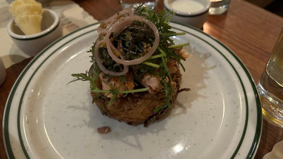 Alpino, a Corktown restaurant inspired by the Alps, serves up sides like the Rosti, a crispy cake of shredded potatoes topped with smoked salmon and spicy mustard greens tossed in sweet pickled onions and mustard seeds.