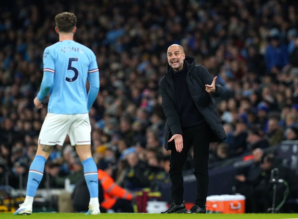 Pep Guardiola gesticulates from the touchline during City’s win over Spurs (PA)