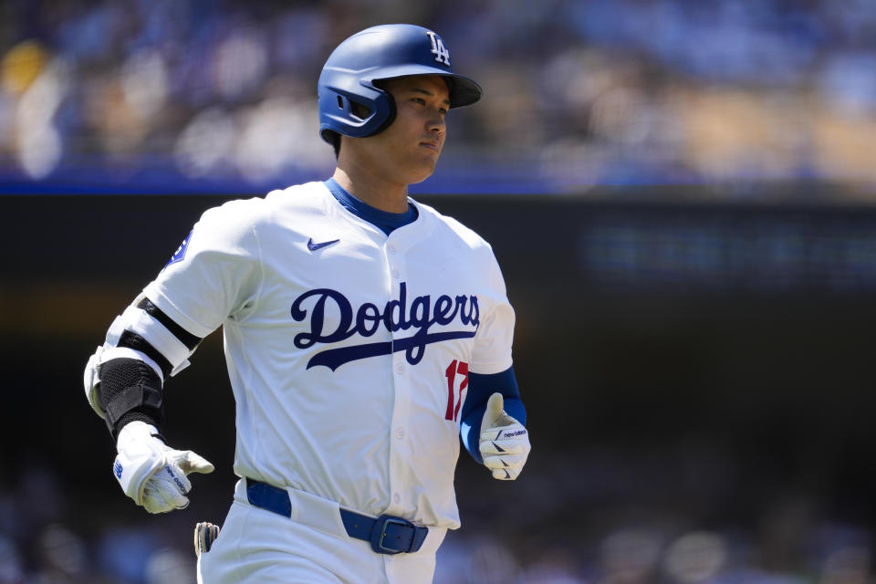 Los Angeles Dodgers designated hitter Shohei Ohtani reacts as he lines out to left field during the fifth inning of a baseball game against the Tampa Bay Rays in Los Angeles, Sunday, Aug. 25, 2024. (AP Photo/Ashley Landis)