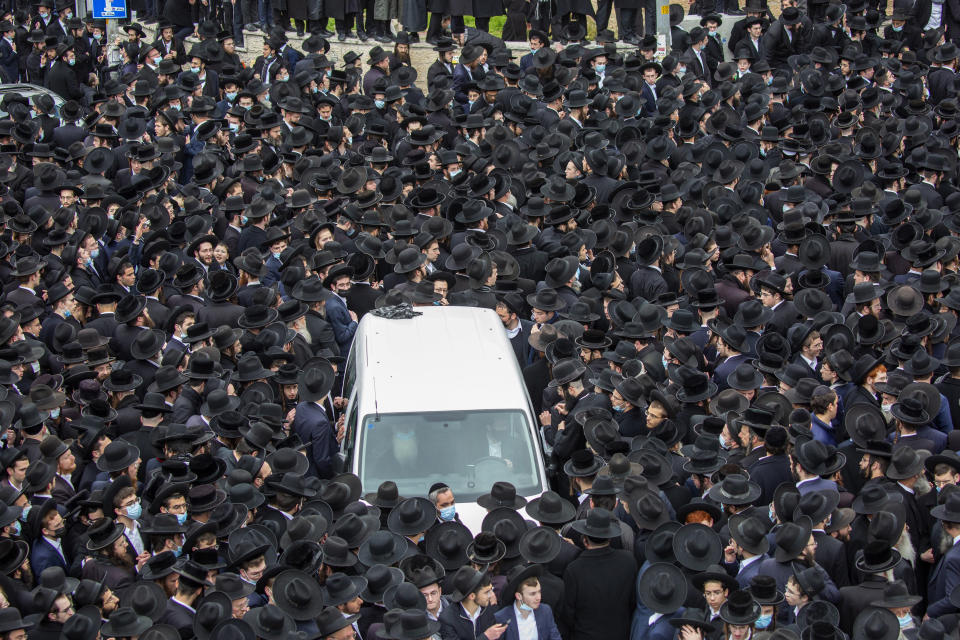 File - In this Sunday, Jan. 31, 2021 file photo, thousands of ultra-Orthodox Jews participate in funeral for prominent rabbi Meshulam Soloveitchik, in Jerusalem. The mass ceremony took place despite the country's health regulations banning large public gatherings, during a nationwide lockdown to curb the spread of the coronavirus. (AP Photo/Ariel Schalit, File)