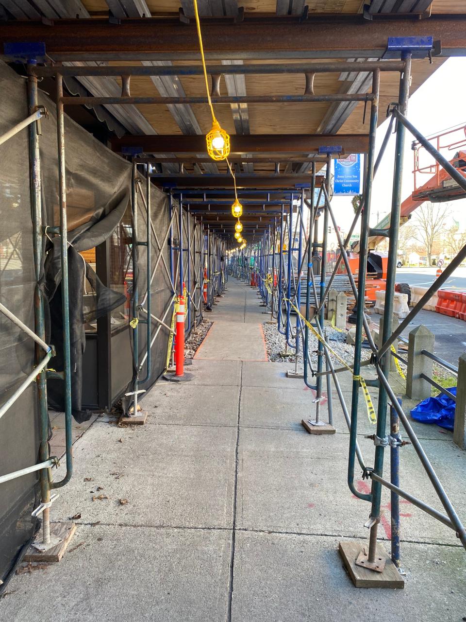 Scaffolding remains overhead on the walkway along businesses on Main Street on Wednesday, Jan. 3, 2024.