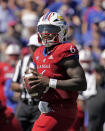 Kansas quarterback Jalon Daniels looks to pass during the second half of an NCAA college football game against Duke Saturday, Sept. 24, 2022, in Lawrence, Kan. (AP Photo/Charlie Riedel)