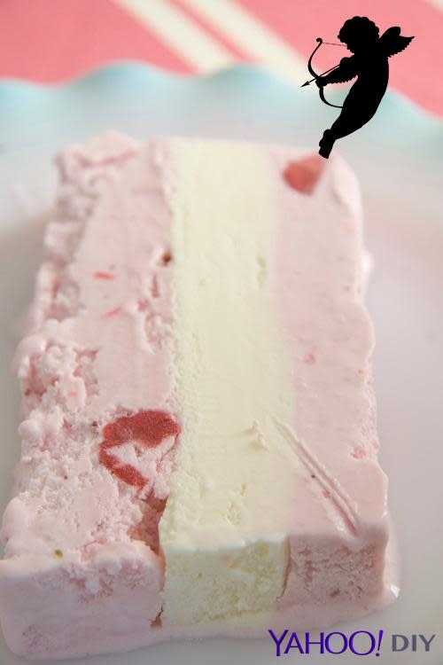 pink sorbet layered between vanilla ice cream cake