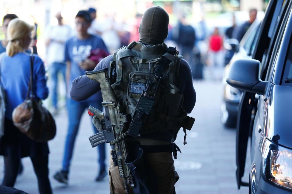 Cologne hostage situation - live: Police storm train station after woman kidnapped