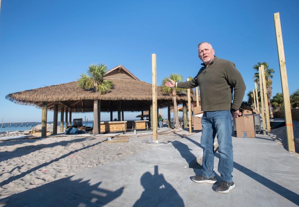 Manager Marty Duffany talks Thursday about the tiki bar at Whiskey Joe's Bar & Grill under construction at the Pensacola Beach boardwalk.