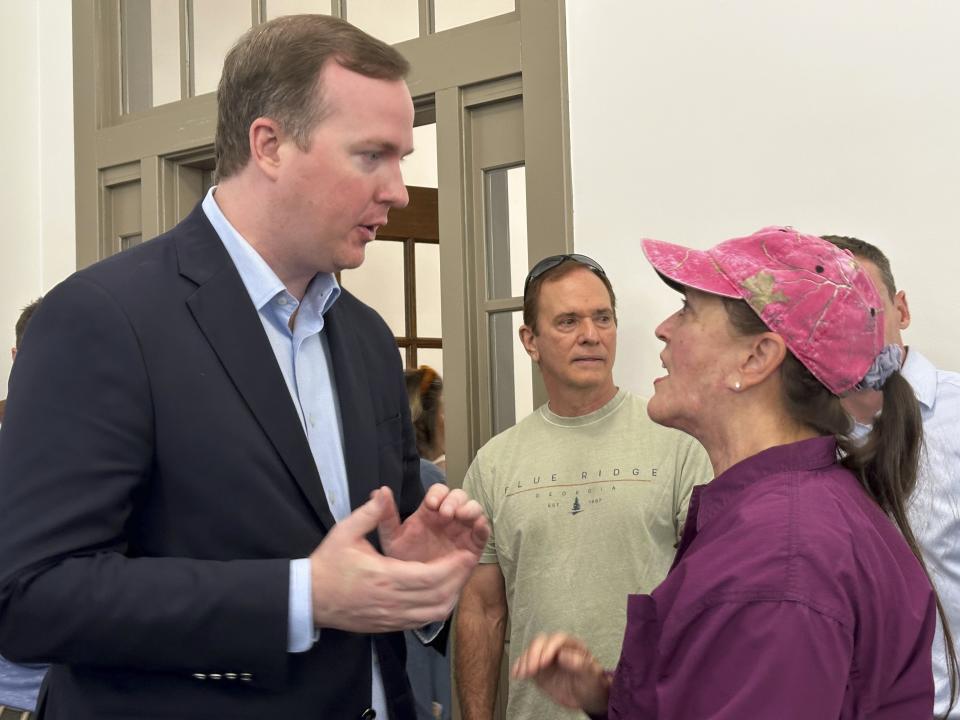 Republican Brian Jack speaks to a voter after a rally in Newnan, Ga. on Monday, June 10, 2024. A former Donald Trump aide, Jack is seeking the GOP nomination in the June 18, 2024 runoff against former state Senate Minority Leader Mike Dugan. (AP Photo/Jeff Amy)