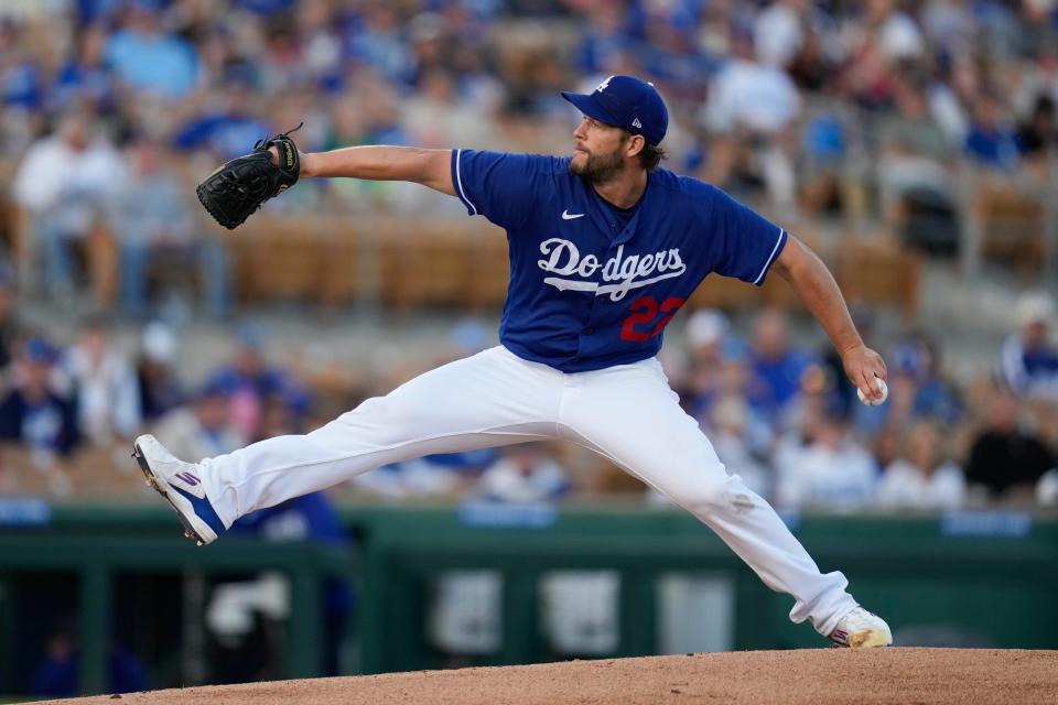 Los Angeles Dodgers starting pitcher Clayton Kershaw (22) throws during the first inning of a spring training baseball game against the Texas Rangers in Glendale, Ariz., Thursday, March 16, 2023. (AP Photo/Ashley Landis)