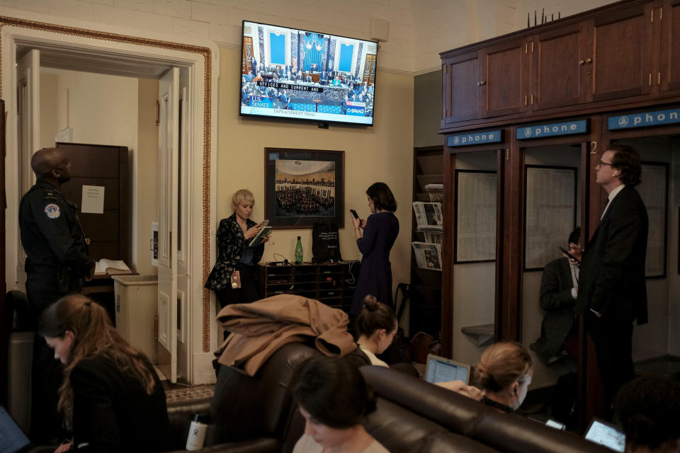 Reporters watch the Senate impeachment vote in the press gallery at the Capitol in Washington, D.C., on Feb. 5, 2020. | Gabriella Demczuk for TIME