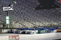 Grant Enfinger (98) and Brett Moffitt (23) lead the field at the start of the NASCAR Truck Series auto race Thursday Sept. 17, 2020, in Bristol, Tenn. (AP Photo/Steve Helber)