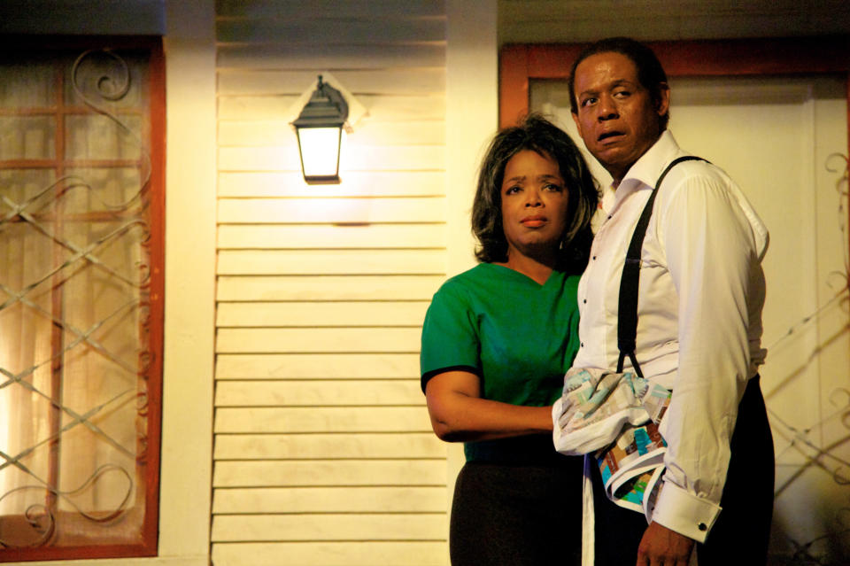 Oprah and Forest Whitaker standing on a porch in a scene from Lee Daniels' The Butler