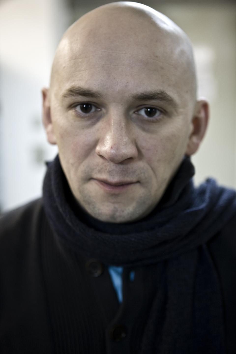 In this photo taken on Tuesday, Jan. 18, 2011, Russian documentary filmmaker Alexander Rastorguyev poses for a photo in Moscow, Russia . Three Russian journalists were killed in an ambush outside the town of Sibut in Central African Republic, officials in both countries said Tuesday, July 31, 2018. The Russian Foreign Ministry identified the slain journalists as Kirill Radchenko, Alexander Rastorguyev and Orkhan Dzhemal. (AP Photo/Alexei Maishev)