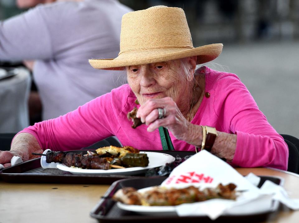 Joanna Harrison, 85, of Worcester enjoys her plate of Greek food during the St. Spyridon Grecian Festival.