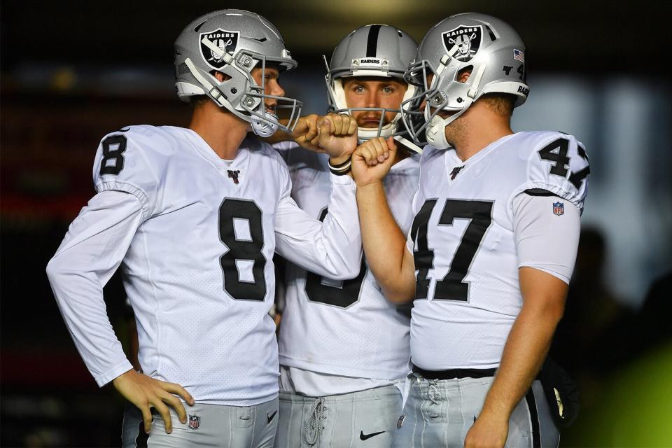 SEATTLE, WASHINGTON - AUGUST 29: Daniel Carlson #8, A.J. Cole #6, and Trent Sieg #47 of the Oakland Raiders gather in the tunnel before the preseason game against the Seattle Seahawks at CenturyLink Field on August 29, 2019 in Seattle, Washington. (Photo by Alika Jenner/Getty Images)