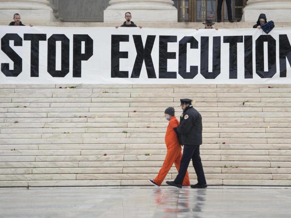 Randy Gardner wearing his executed brother's prison jumpsuit during an anti death penalty protest in Washington, 2017 (Getty)