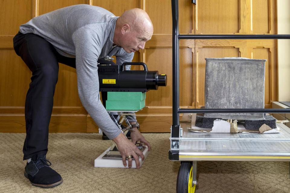 In this photo provided by the U.S. Military Academy at West Point, Kenneth Allen, professor of nuclear engineering, conducts an X-ray on a time capsule, Friday, June 9, 2023. The long-forgotten time capsule, a small lead box measuring about a cubic foot, was discovered in May 2023, during restoration to a monument honoring Revolutionary War hero Thaddeus Kosciuszko on the grounds of West Point, in New York. The box will be opened during a livestreamed event, Monday, Aug. 28. (Christopher Hennen/U.S. Army via AP)