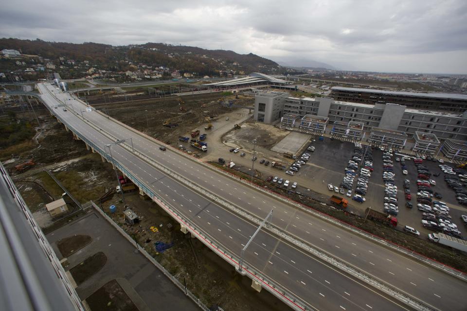 In this photo taken on Wednesday, Nov. 27, 2013, a new highway is seen on the fringes of the Olympic park in Sochi, Russia. As the Winter Games are getting closer, many Sochi residents are complaining that their living conditions only got worse and that authorities are deaf to their grievances. (AP Photo/Alexander Zemlianichenko)