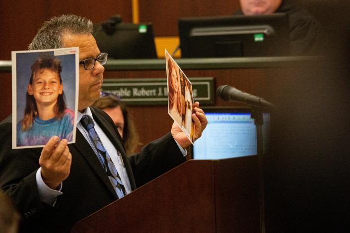 Assistant State Attorney Daniel Feinberg holds up evidence photos during closing arguments in the penalty phase of Joseph Zieler&#39;s trial on Wednesday, May 24, 2023. Zieler was convicted in the murders of Robin Cornell, 11, and Robin Story. In this phase, the jury decides on whether to recommend life in prison or the death penalty.