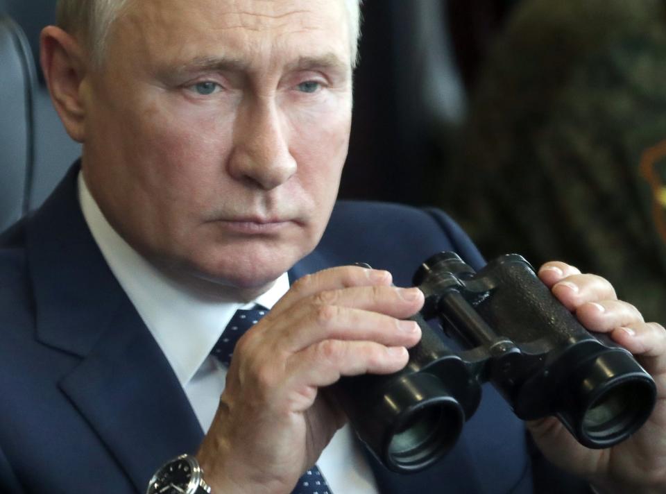 Russian President Vladimir Putin holds a binoculars as he watches the joint strategic exercise of the armed forces of the Russian Federation and the Republic of Belarus Zapad-2021 at the Mulino training ground in the Nizhny Novgorod region, Russia, Monday, Sept. 13, 2021. The military drills attend by servicemen of military units and divisions of the Western Military District, representatives of the leadership headquarters and personnel of military contingents of the armed forces of Armenia, Belarus, India, Kazakhstan, Kyrgyzstan and Mongolia. (Sergei Savostyanov, Sputnik, Kremlin Pool Photo via AP)