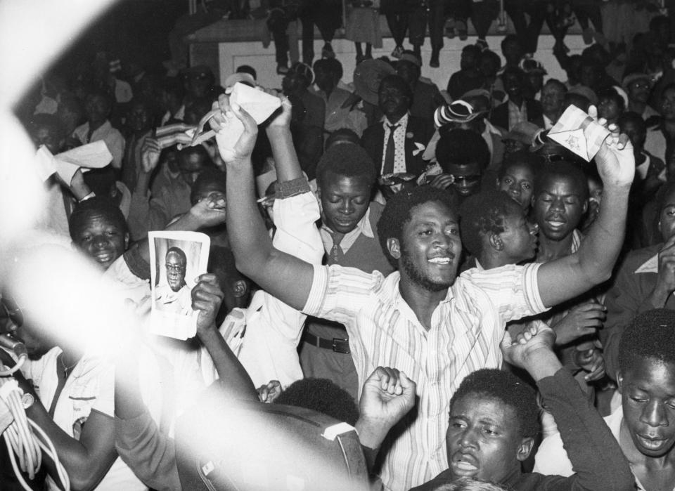 Residents of Salisbury cheer during the proclamation of independence for the nation of Zimbabwe in April 1980. (Photo: Sovfoto/UIG via Getty Images)