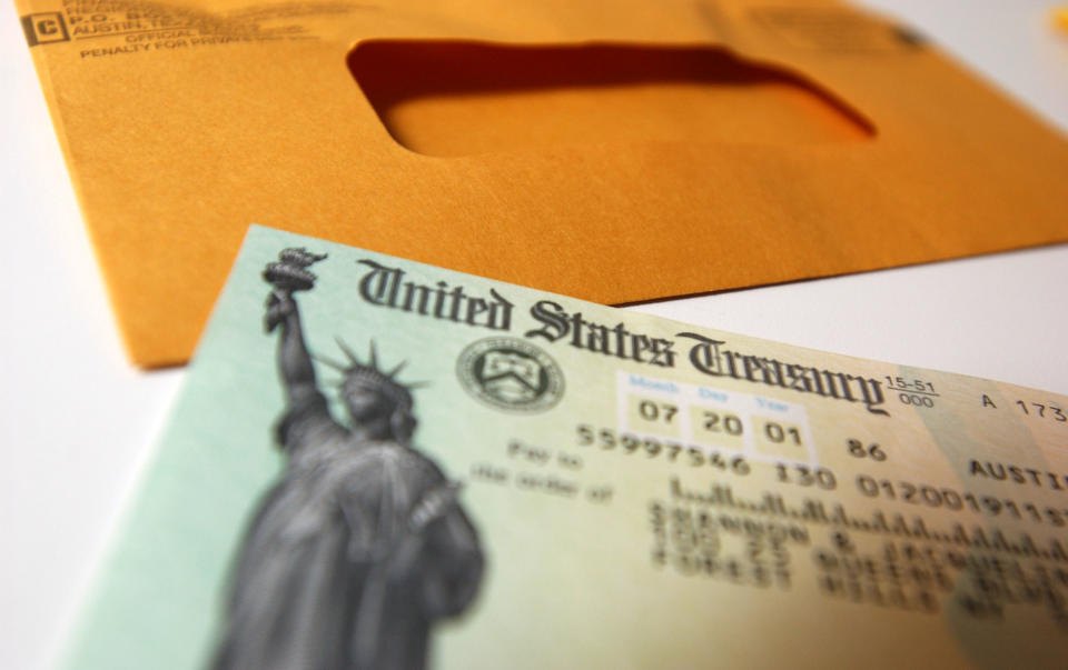 392397 02: A tax payer rebate check sits on a table July 25, 2001 in New York City. The U.S. government is sending out 92 million tax rebate checks over 10 weeks as part of the Bush administrations tax break. (Photo by Spencer Platt/Getty Images)