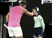 Spain's Rafael Nadal checks a ball girl after a ball hit her during his second round match against Federico Delbonis of Argentina at the Australian Open tennis championship in Melbourne, Australia, Thursday, Jan. 23, 2020. (AP Photo/Dita Alangkara)